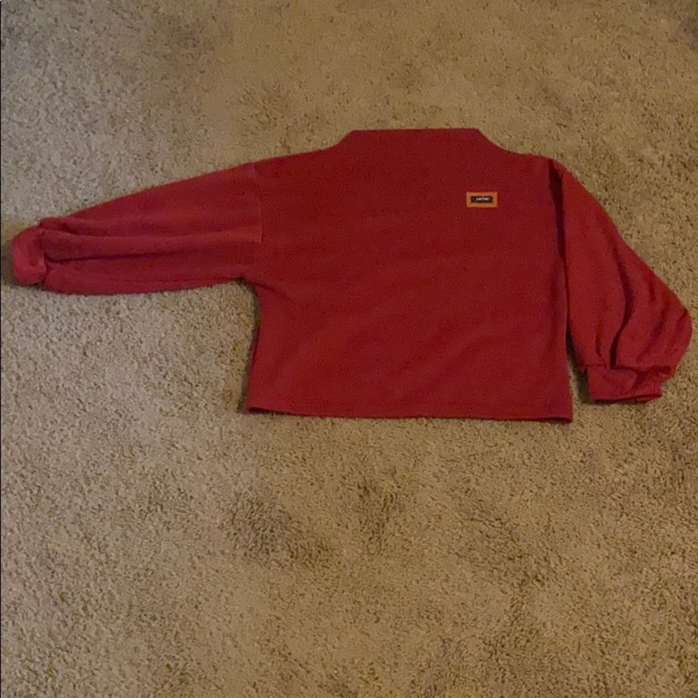 Red cropped sweater with leather patch